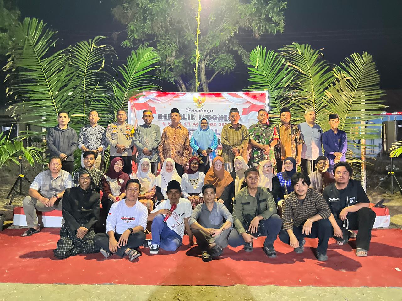 Semarak HUT ke-81 RI, Bhabinkamtibmas Polsek Banggae Hadiri Pesta Rakyat Warga Lingkungan Baruga